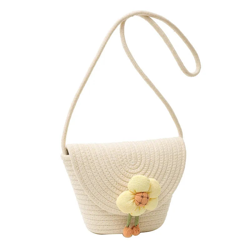 Cotton and linen bucket bag with woven flower details, clamshell shape, available in five colours including sky blue