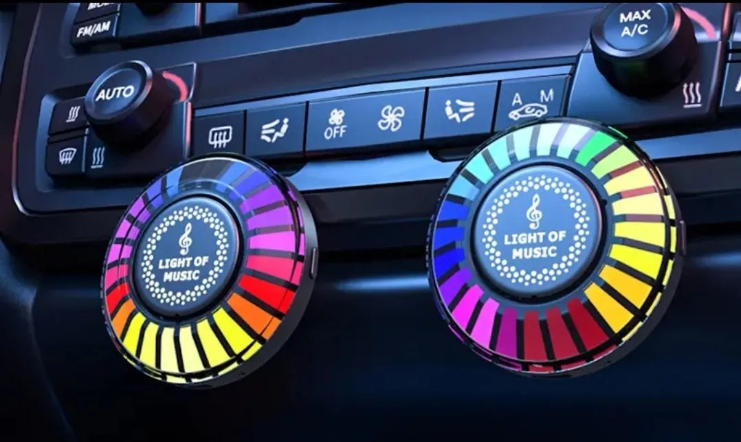 Car air outlet aromatherapy light with RGB illumination attached to vehicle vent