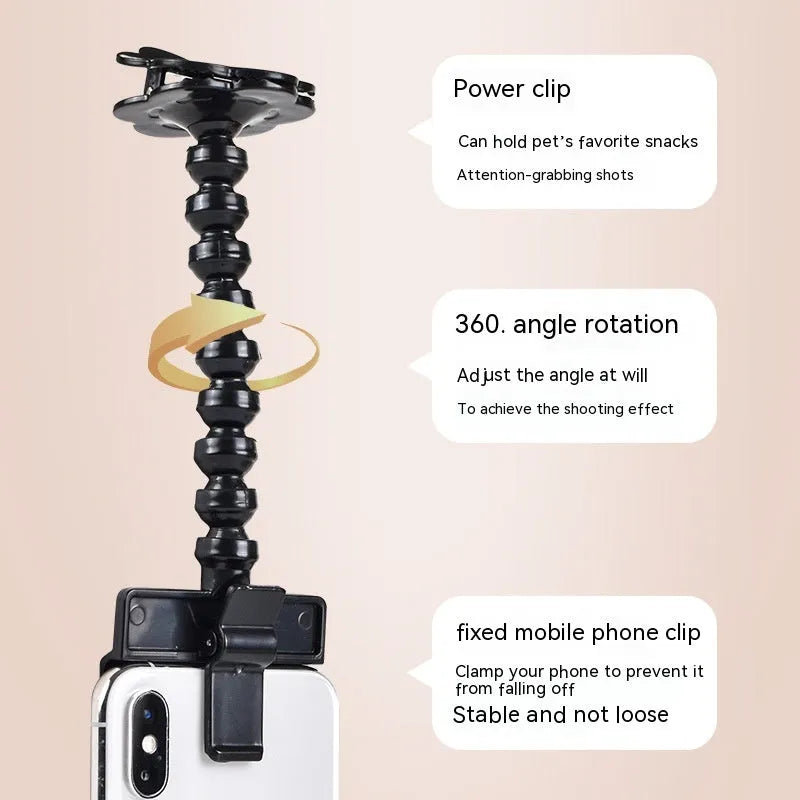Black pet selfie stick with rotating snack clip attached to mobile phone for animal photography