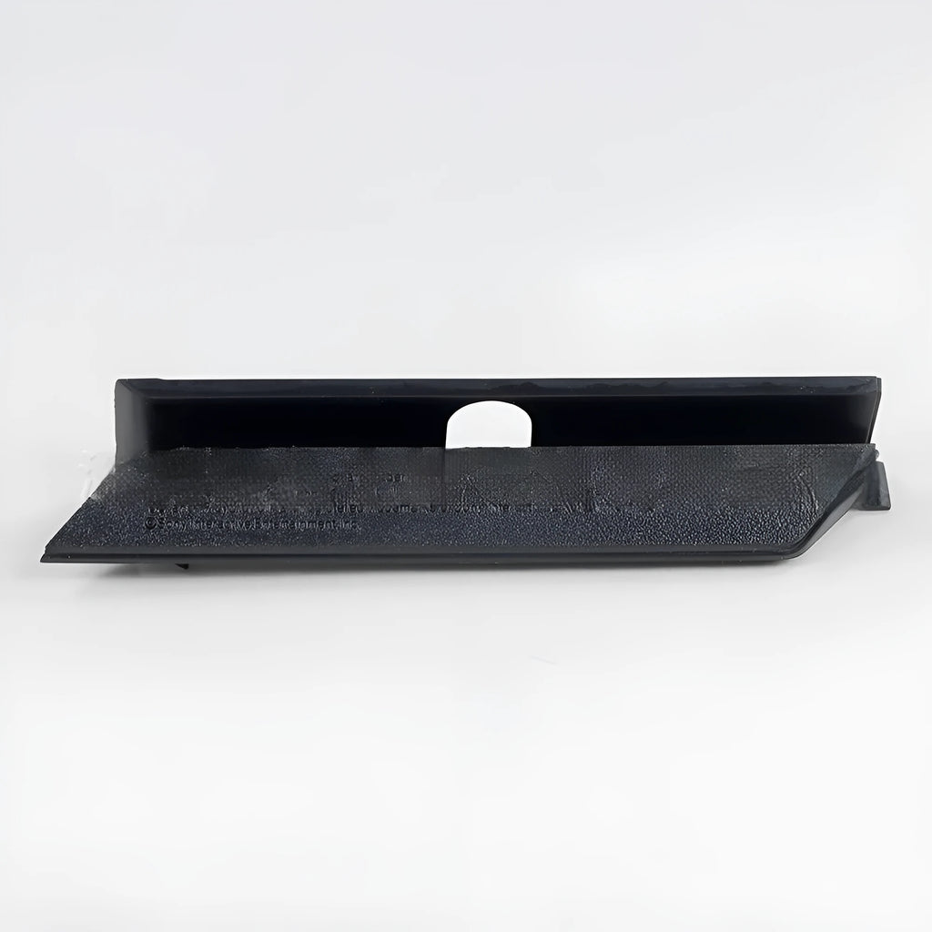 A black plastic hard drive bay cover for a computer case.