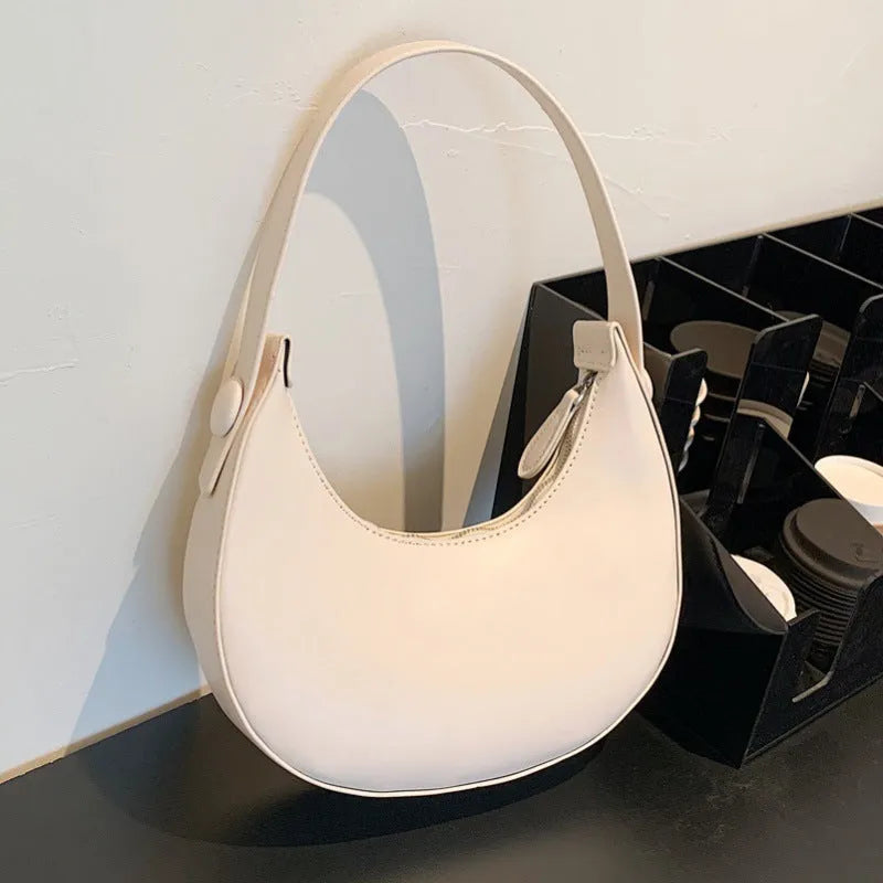Retro dumpling shape shoulder bag in PU leather showing dimensions 21x20x6cm with zipper change bag interior