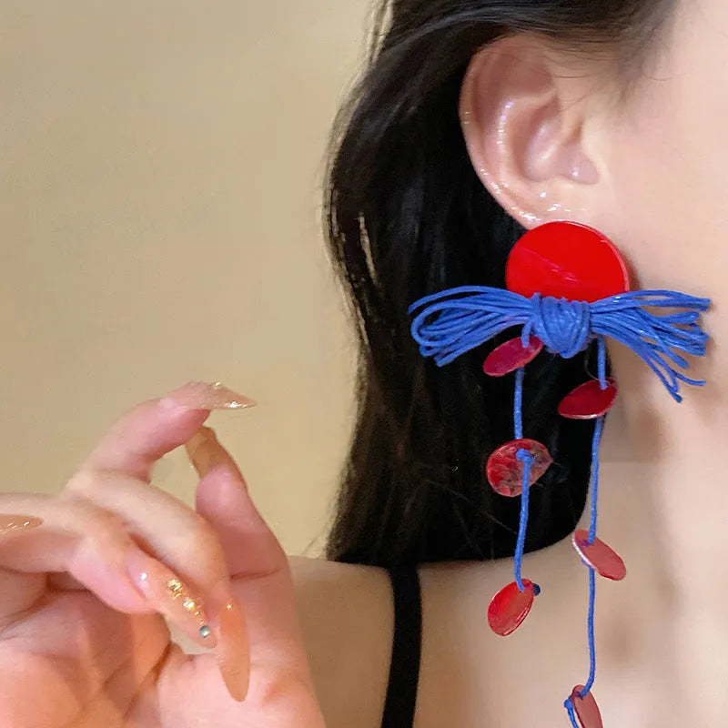 Women's geometric cloth earrings with blue resin flower detail and Silver Needle colour