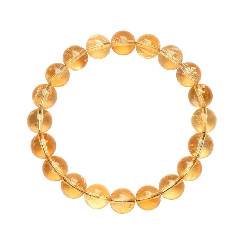 Natural yellow citrine gemstone bracelet with geometric beads on white background