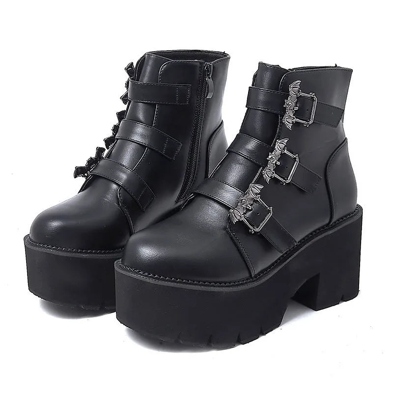 Black women's punk-style short Martin boots featuring a bat buckle, side zipper, and thick heel