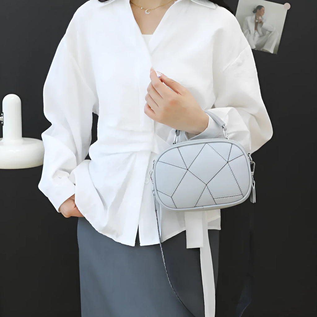 Round women's PU leather patchwork small bag with three-layer design and stitching detail