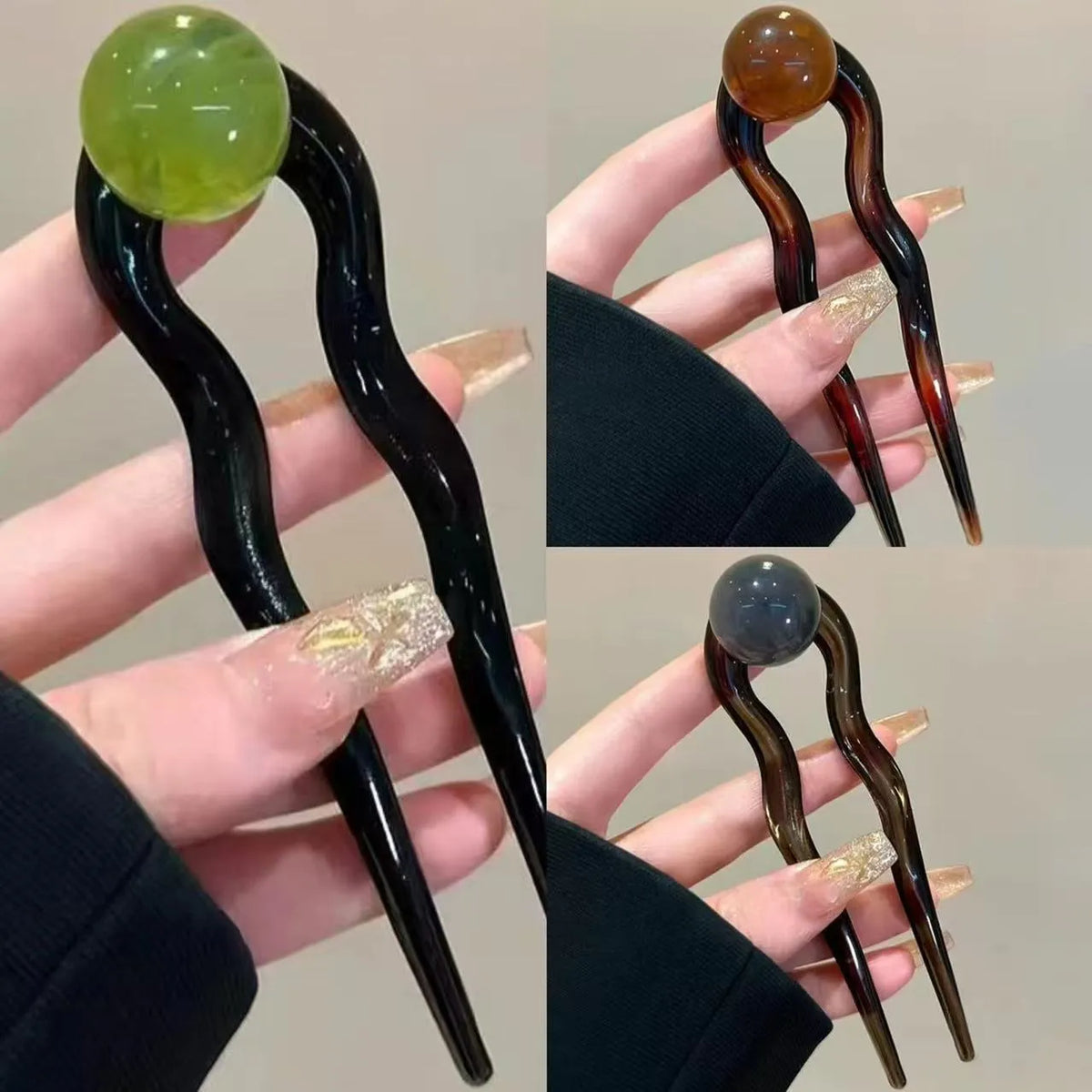 Acrylic U-shaped hair barrette with a small spherical decoration in a beige and caramel two-tone colour combination.