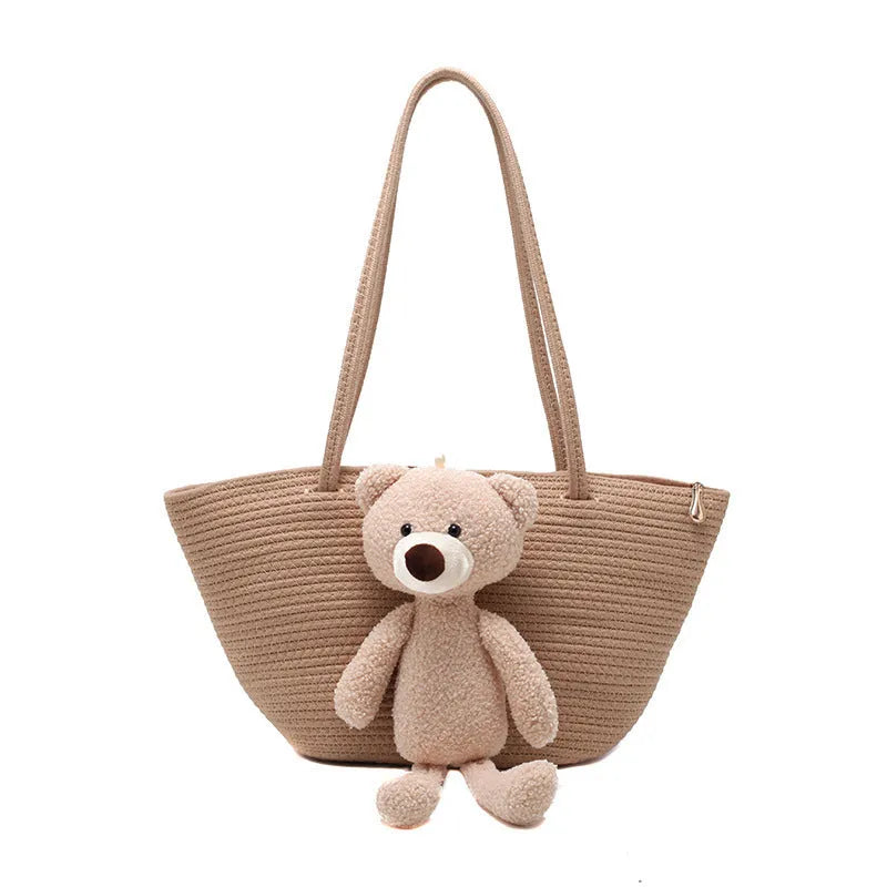 Cotton and linen woven dumpling-shaped shoulder bag with double straps in khaki colour.