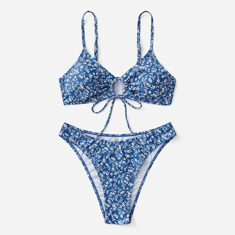 Blue polyester swimsuit three-piece set showing top and shorts, laid flat.
