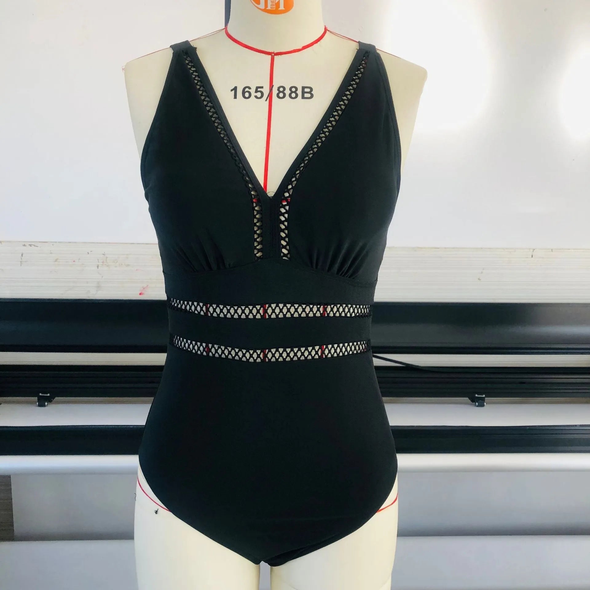 Black plus size women's bikini swimsuit with mesh stitching and print design in sizes S to 5XL