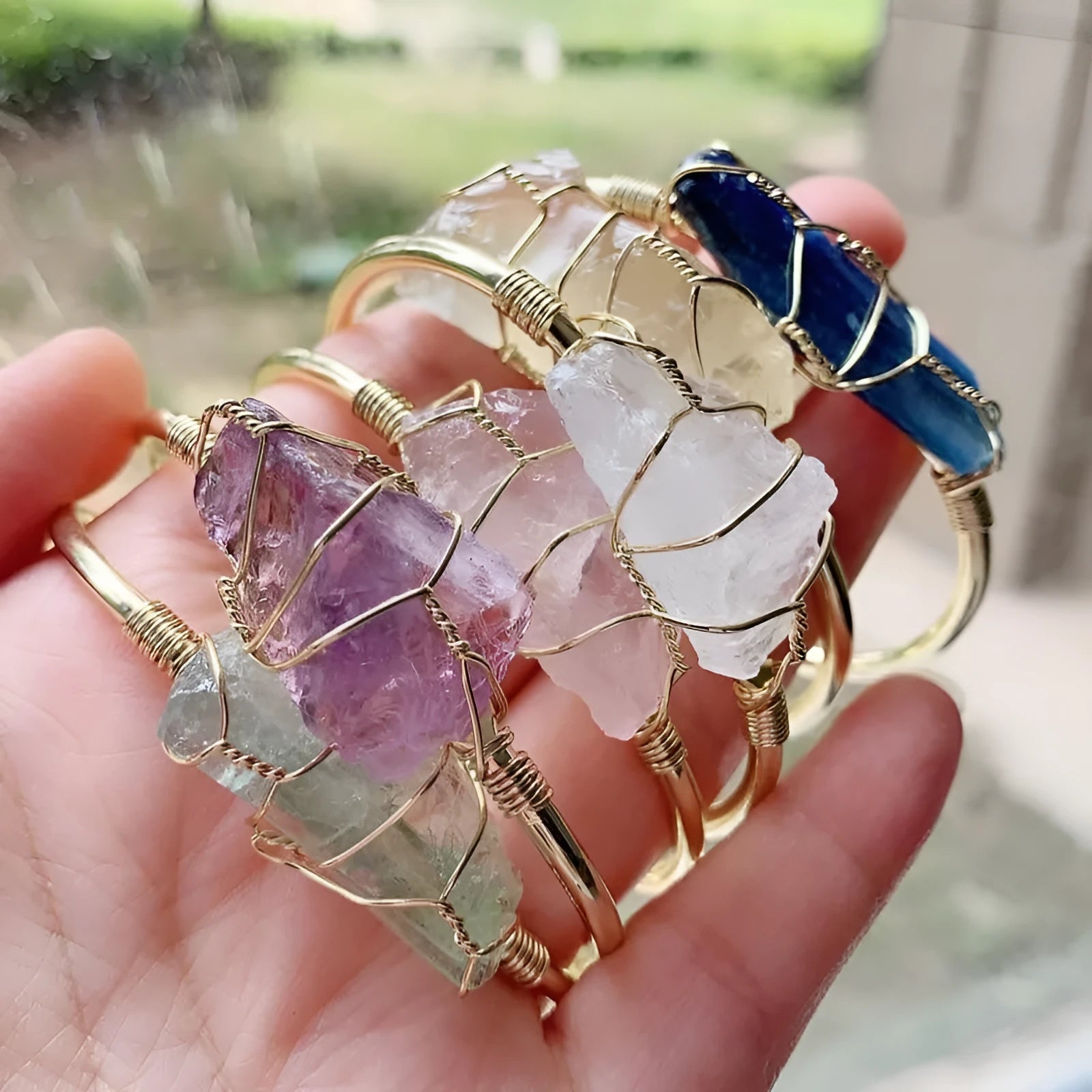 Natural rough stone crystal bracelet with gold winding in a geometric bohemian style.