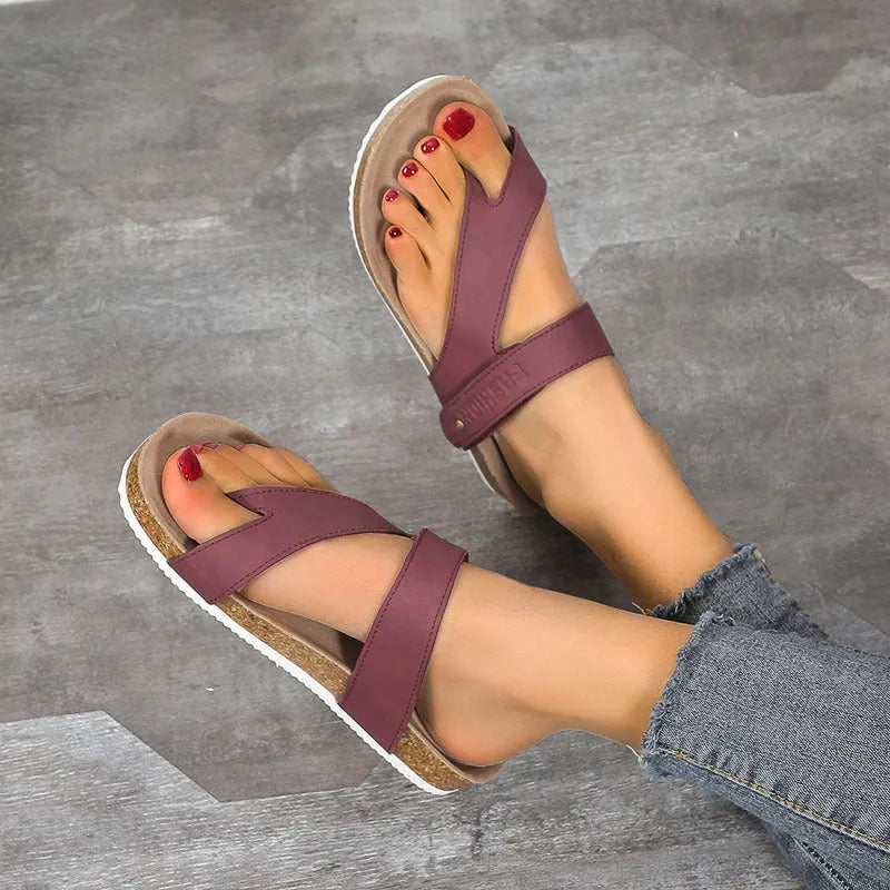 Women's flat toe ring flip-flops in blue with a thick foam sole, shown from the side.