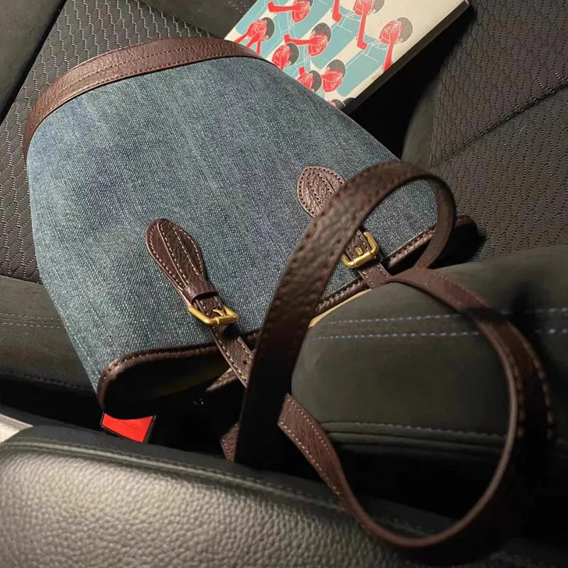 Denim patchwork one-shoulder bucket handbag showing 23x27x16cm dimensions and retro design