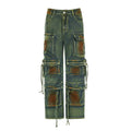 Loose blue denim cargo trousers with gradient colour pockets and a colour bloom wash
