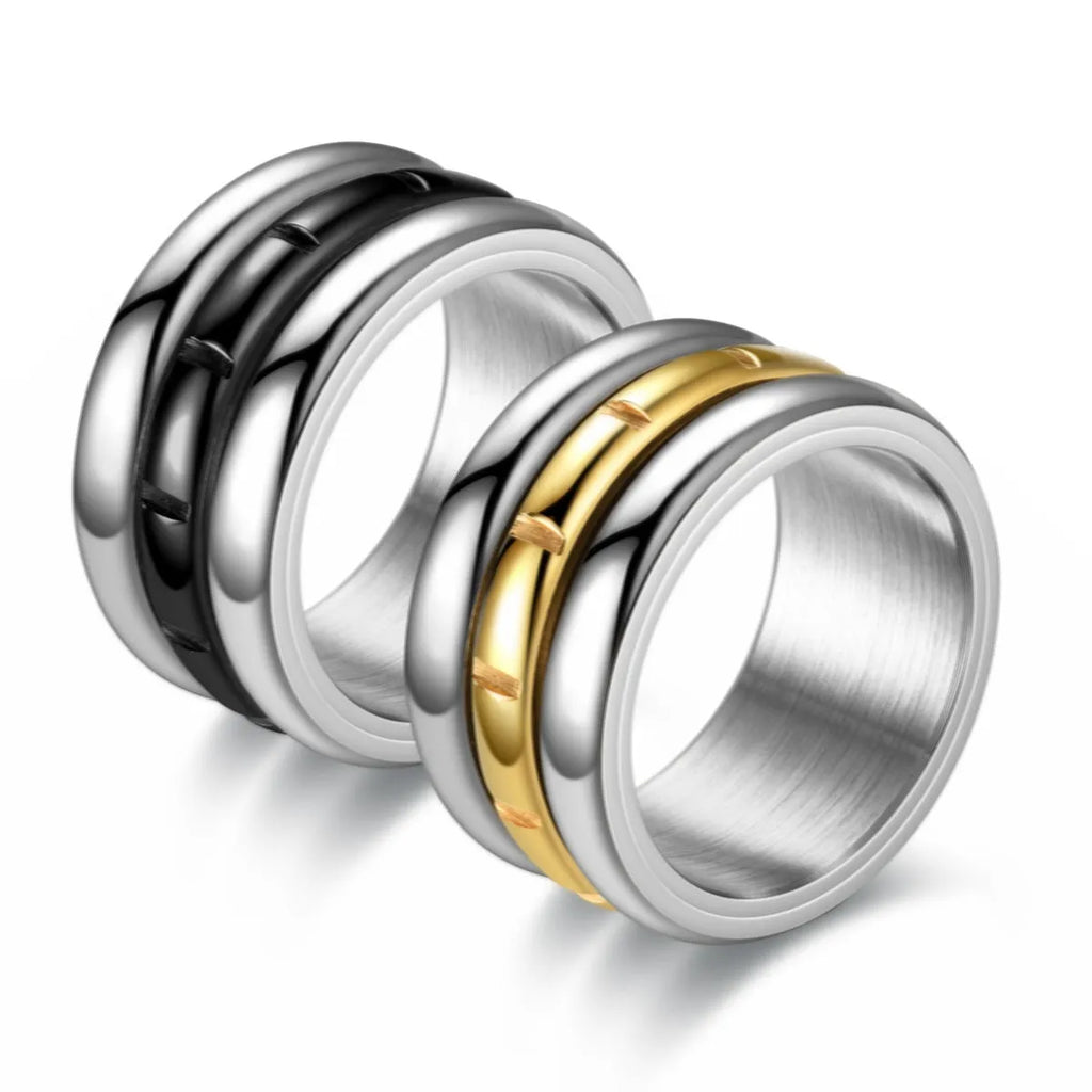 Titanium steel rotating ring with carved geometric band, shown in black or gold, unisex sizes 6 to 13