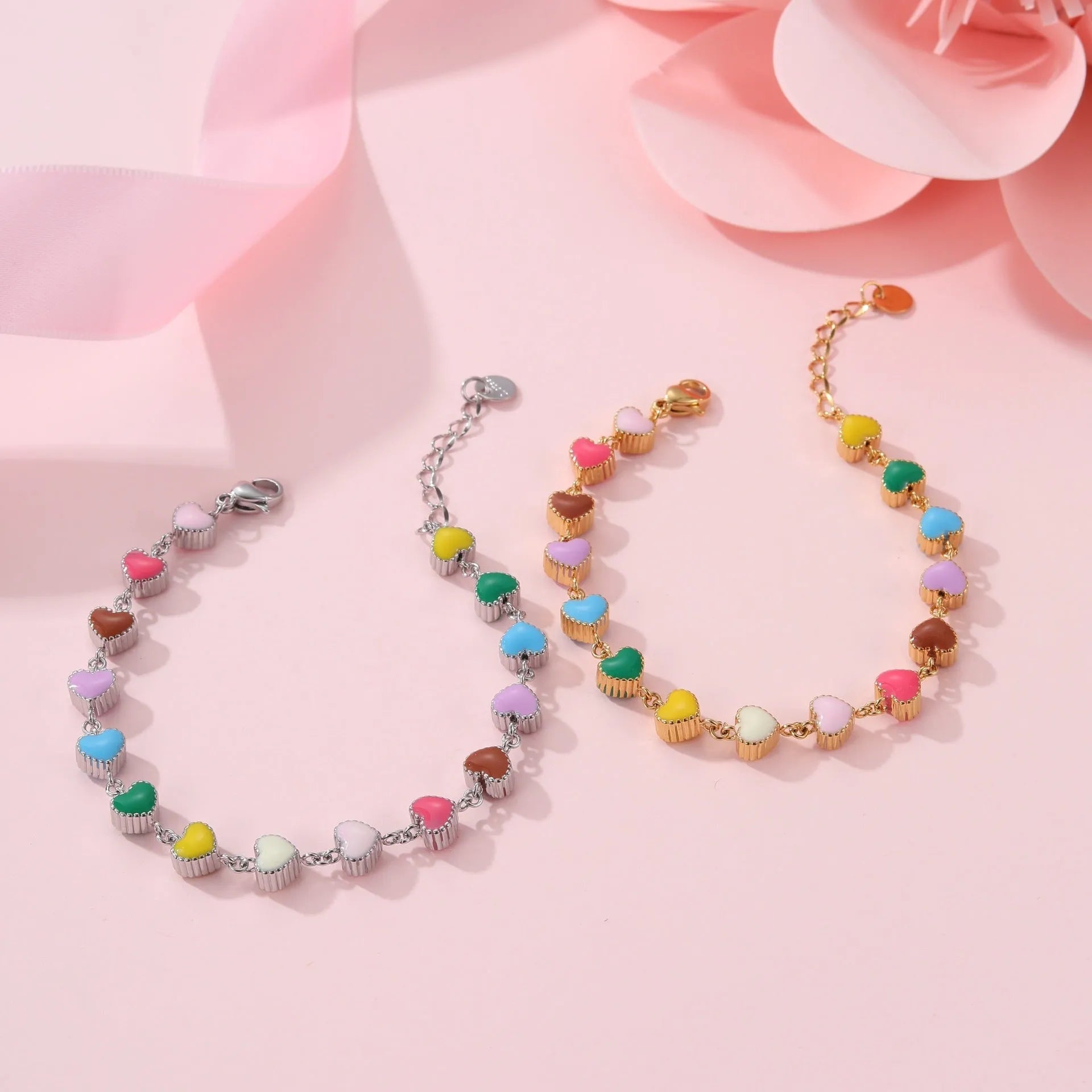 Women's titanium steel bracelet with heart-shaped charm in gold or steel electroplated finish