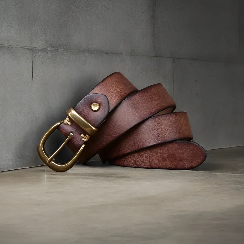 Men's black genuine cowhide leather belt with a copper pin buckle on a white background.