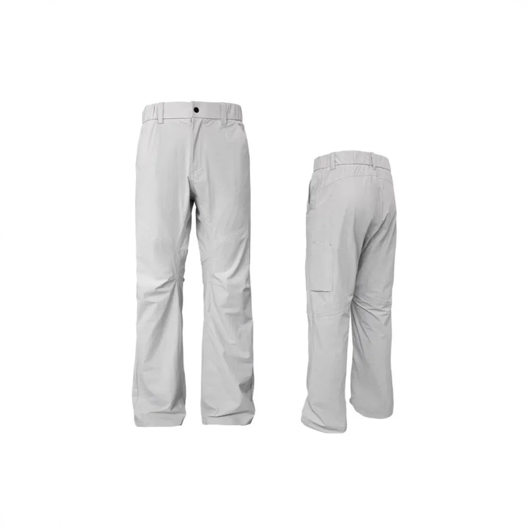 Man wearing grey 3D cut deconstructed casual trousers with a straight leg and elasticated waistband.