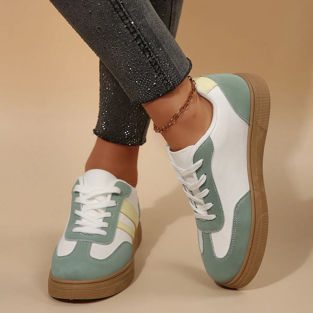 Green women's retro casual pumps with cross straps, low heel, and round toe.