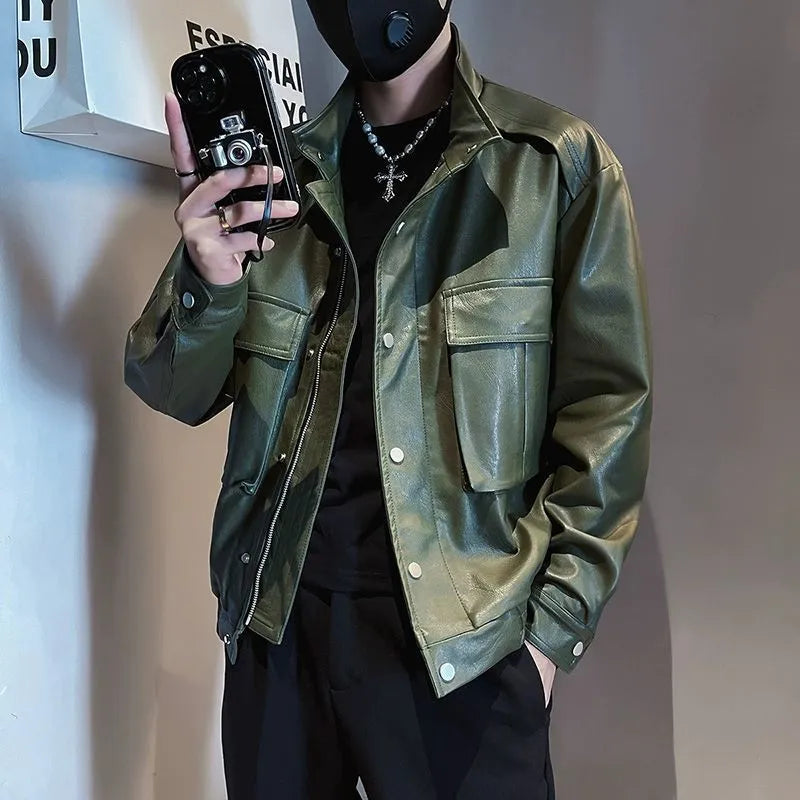 Men's black Korean style PU leather jacket with side pockets and straight hem on a hanger.