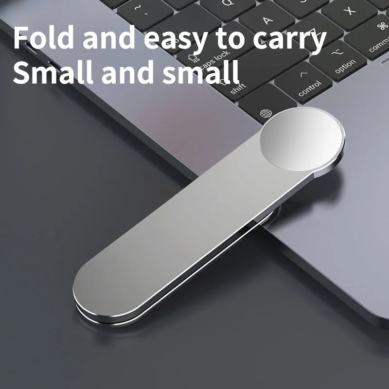Silver aluminium alloy magnetic mobile phone bracket on desk with laptop for dual screen use