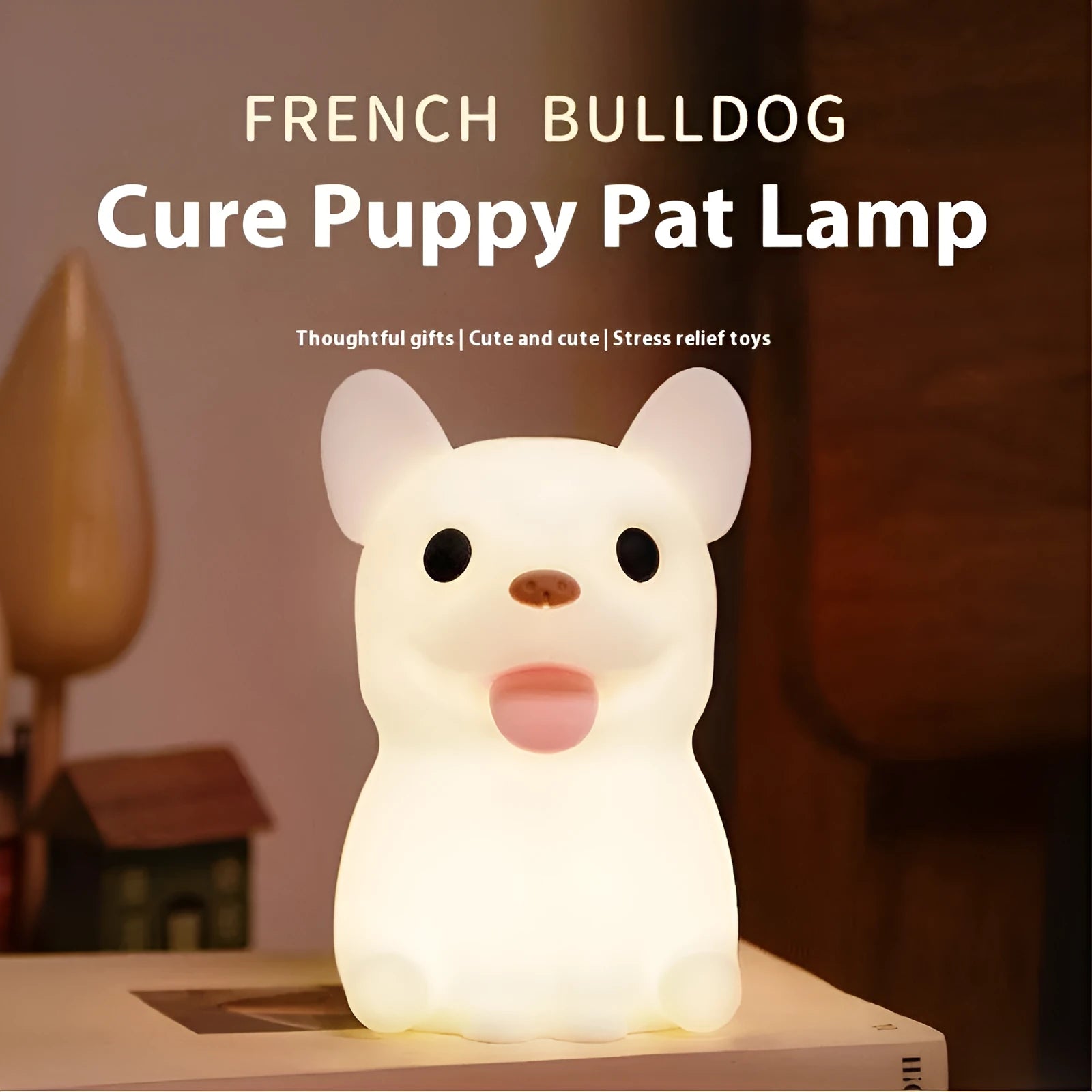 Soft silicone USB night light with dimmer in a cartoon animal design on a bedside table.