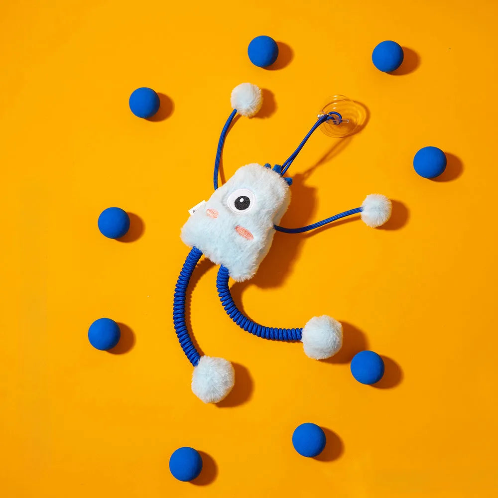 Blue plush cat toy with a telescopic elastic rope and a mint-coloured bell ring on a white surface.