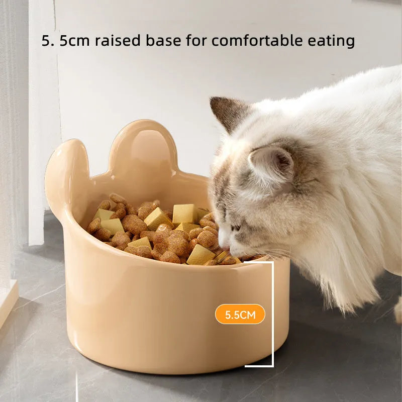 White and yellow ceramic pet feeding bowls with animal patterns in large and small sizes