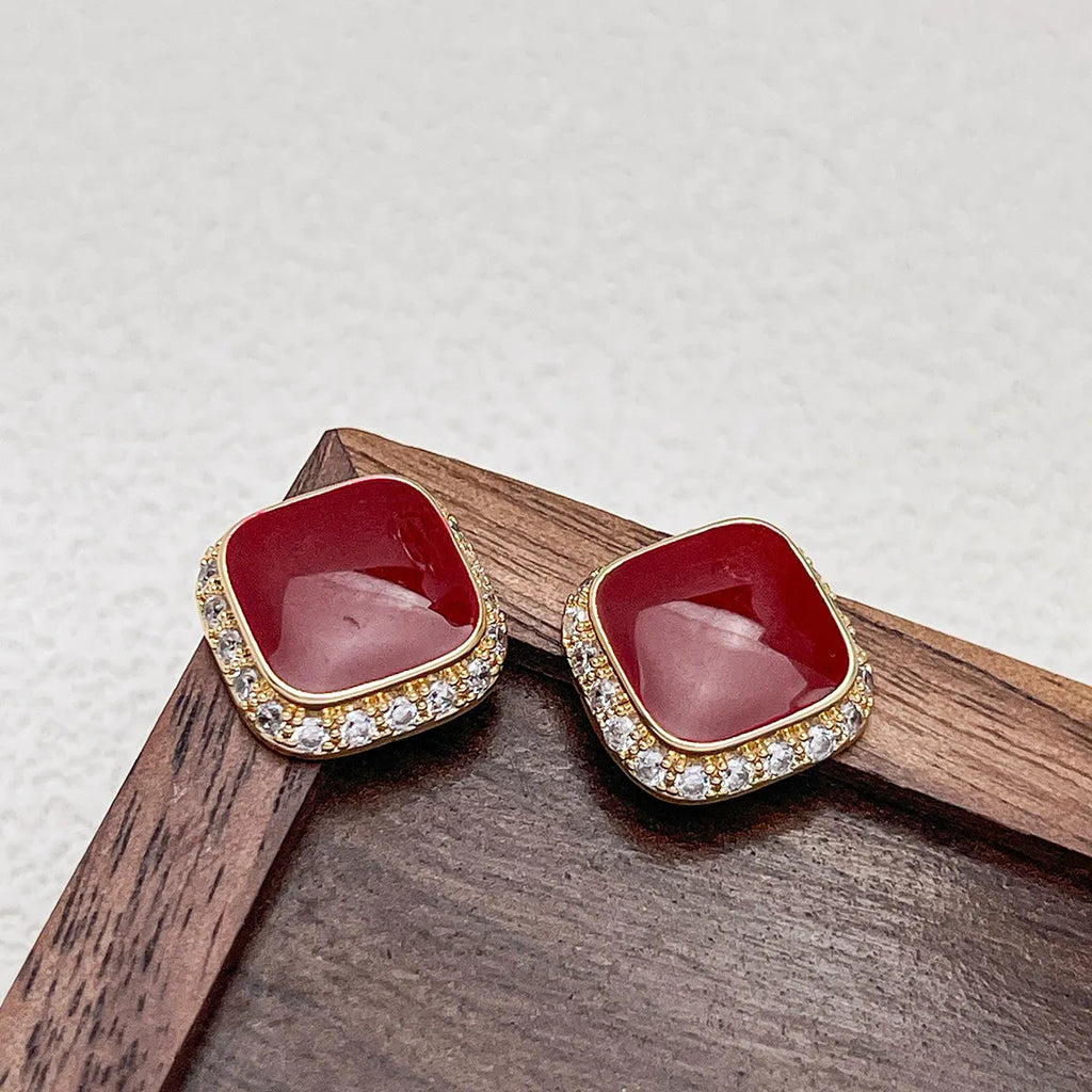 Red square geometric earrings with inlaid design on alloy base