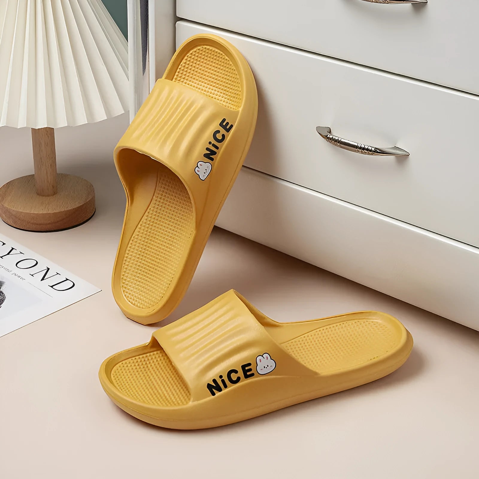 A pair of EVA flip flop slippers with a cartoon pattern, shown in one of six available colours.