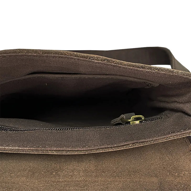Men's brown Crazy Horse leather crossbody backpack on a plain background, showing retro design and iPad pocket