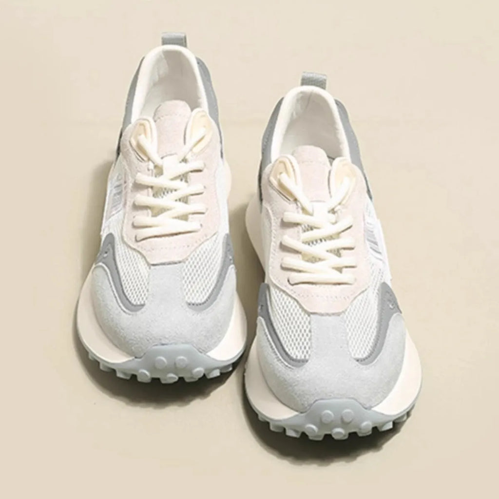 Women's grey and pink low-top retro sneaker with round toe and flat rubber sole