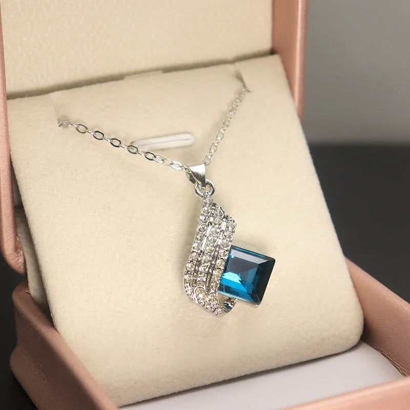 Glass pendant on alloy cross chain necklace with matching electroplated earring studs set