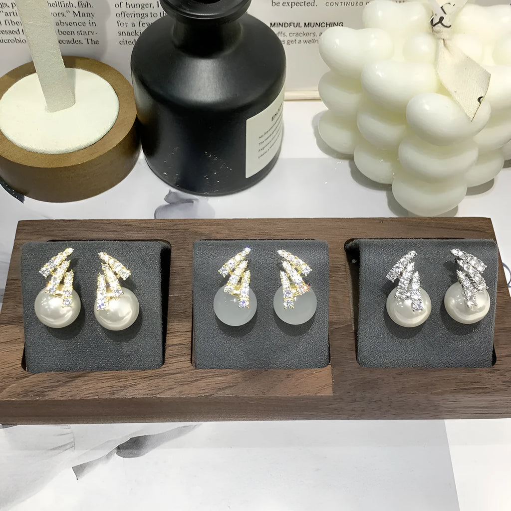 Curved zircon pearl earrings in gold tone and silver tone with cat eye stone or white pearl detail