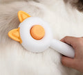 Self-cleaning pet dematting comb with stainless steel pins in greenish white and orange white colour options