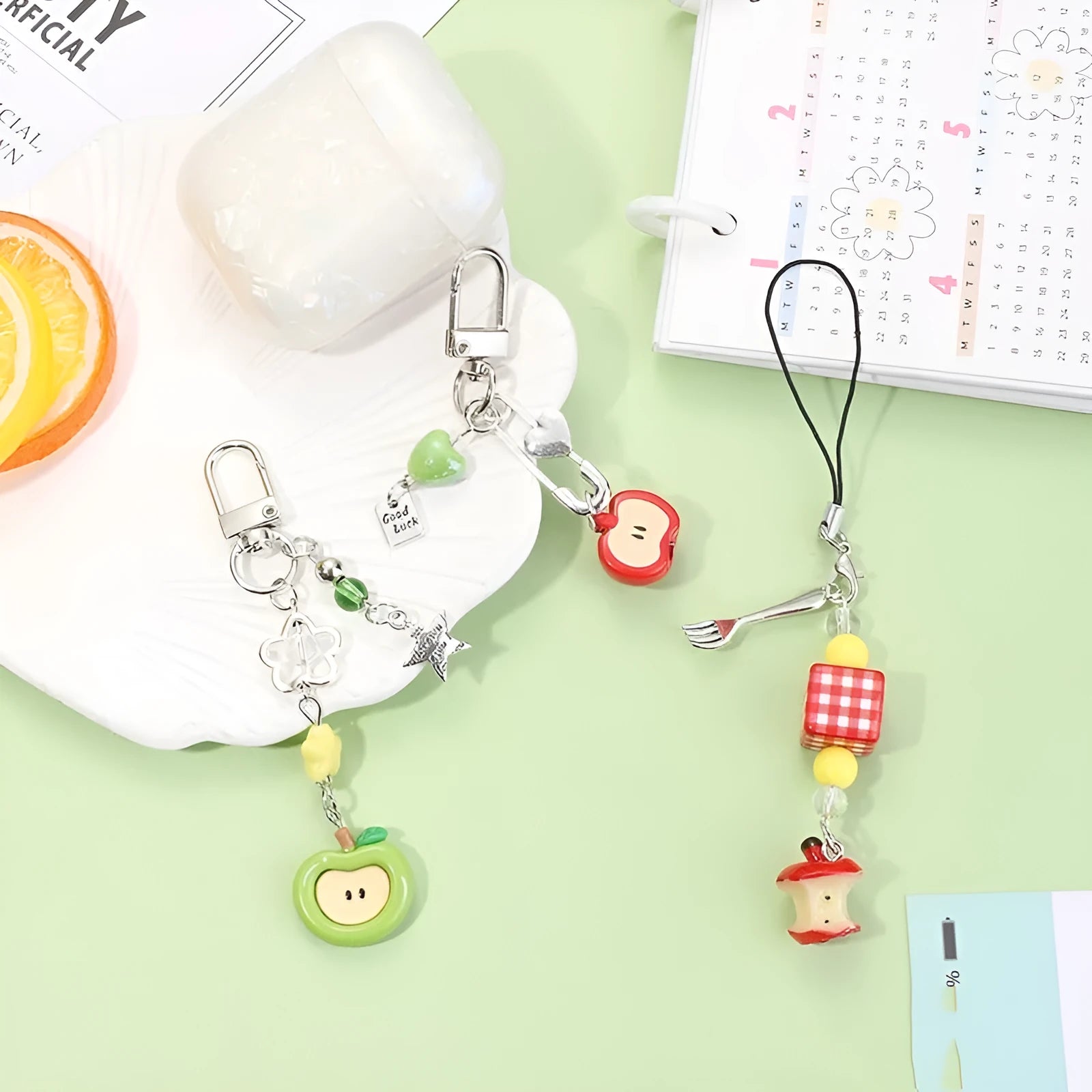 Fruit mobile phone charm keychain with apple, strawberry designs on plastic/resin with rope attachment
