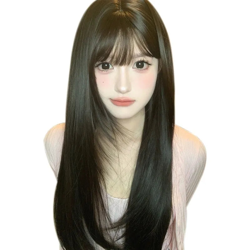 Dark brown long straight synthetic women's wig with a fringe on a wig head.