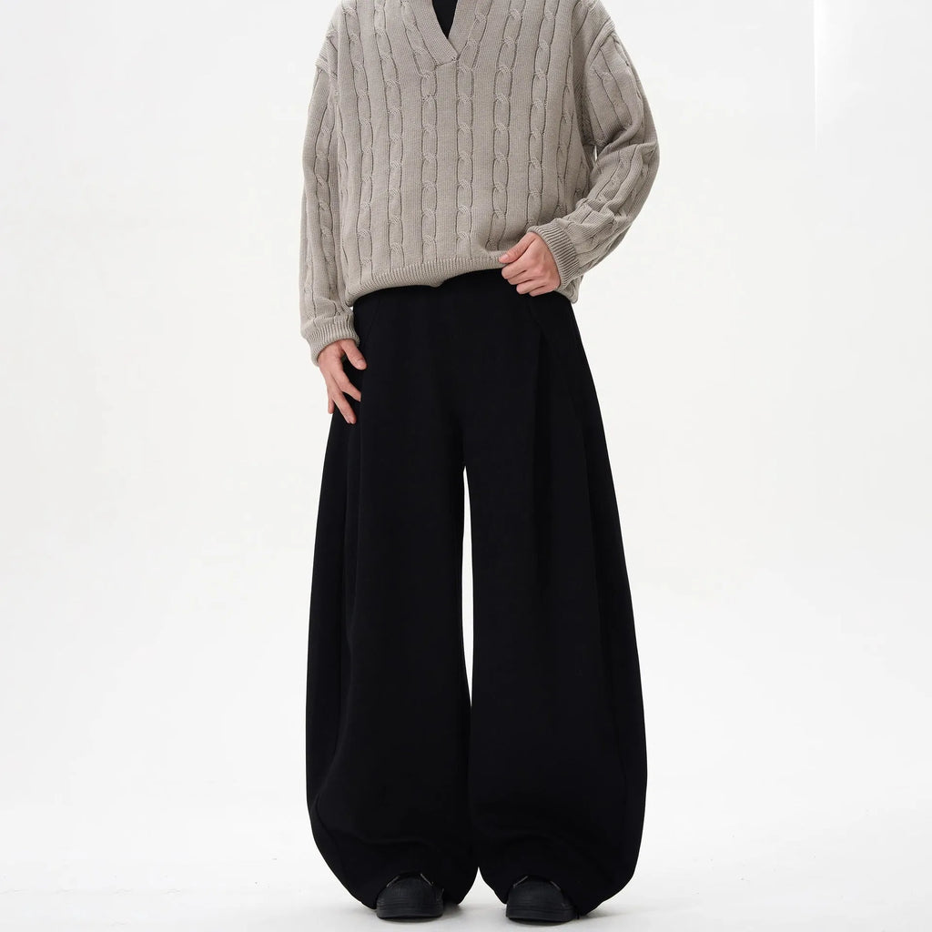 Women's wide-leg mid-waist casual trousers in grey, made from polyester fibre, shown on a model.