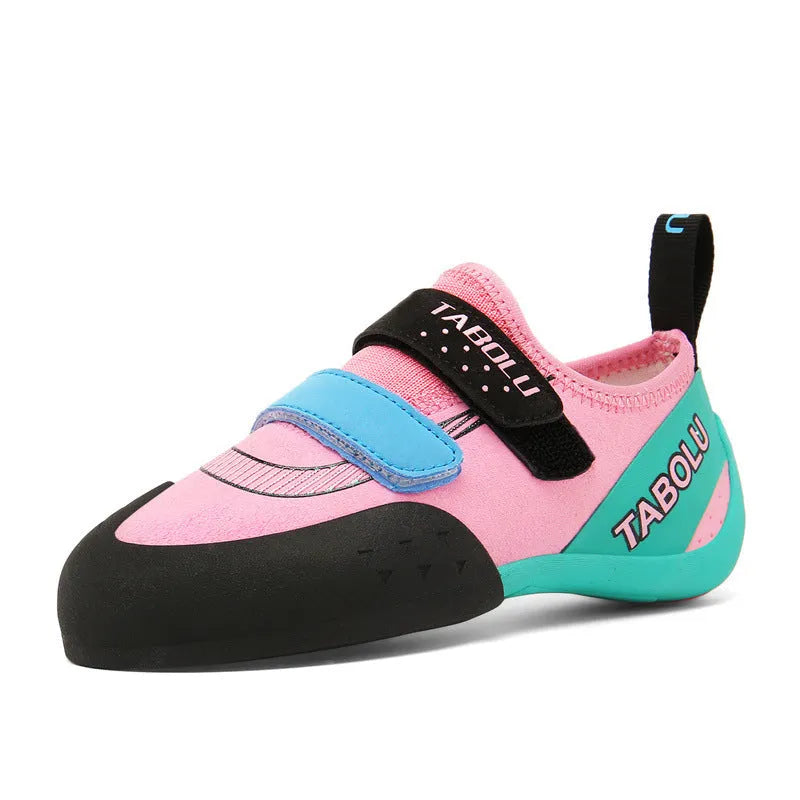 Beginner rock climbing shoes with Velcro straps and non-slip rubber soles in black/red colour