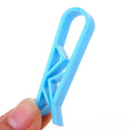 A white PP plastic non-slip fixed clip for holding bin bags to the side of a rubbish bin.