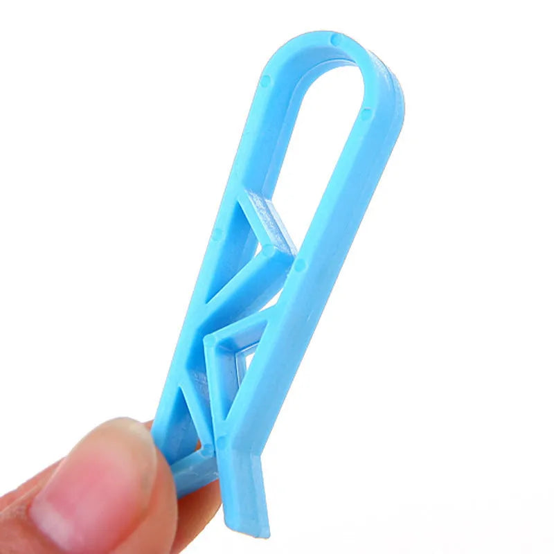 A white PP plastic non-slip fixed clip for holding bin bags to the side of a rubbish bin.