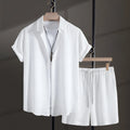 Men's white cotton blend beach shirt and shorts suit set laid flat showing cardigan style and short sleeves