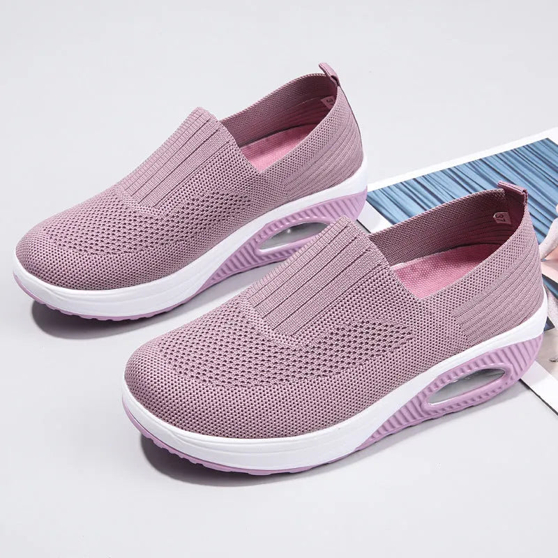 Women's mesh running shoes in beige with round toe and air cushion sole.