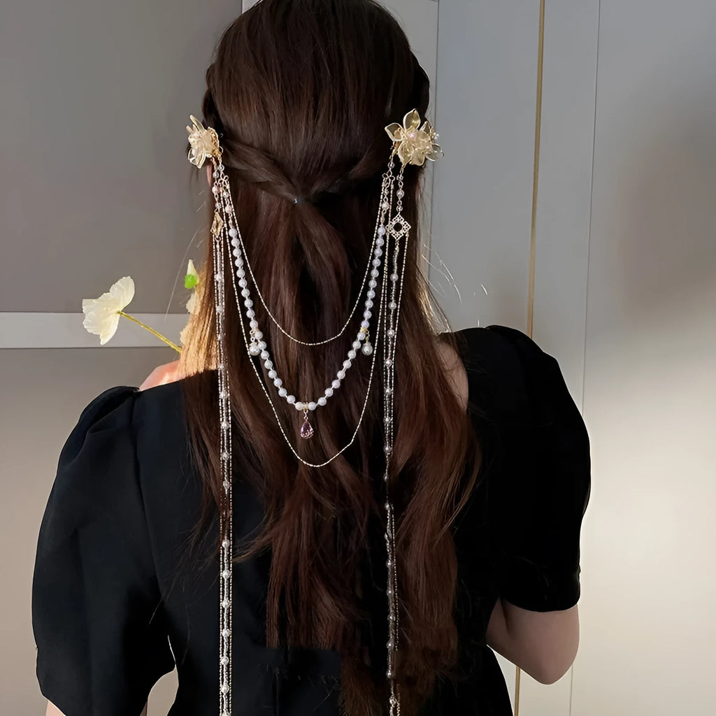 Gold acrylic women's hairpin with flower shape, pearl diamond details, and long tassel design