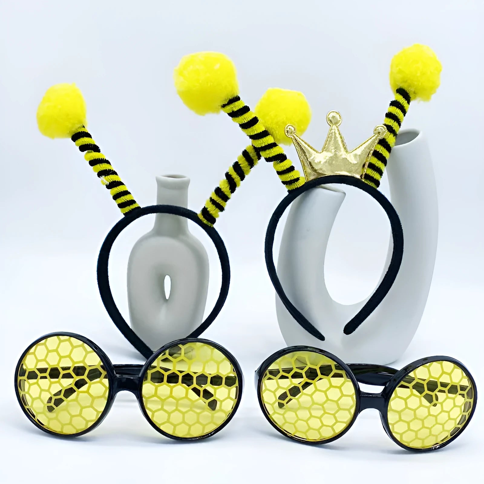 Yellow children's fancy dress set with bee motif headband and matching insect glasses.