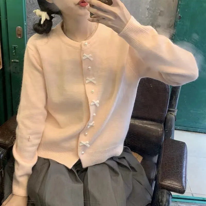Women's pink cardigan with bow pearl buttons, regular sleeves, medium thickness
