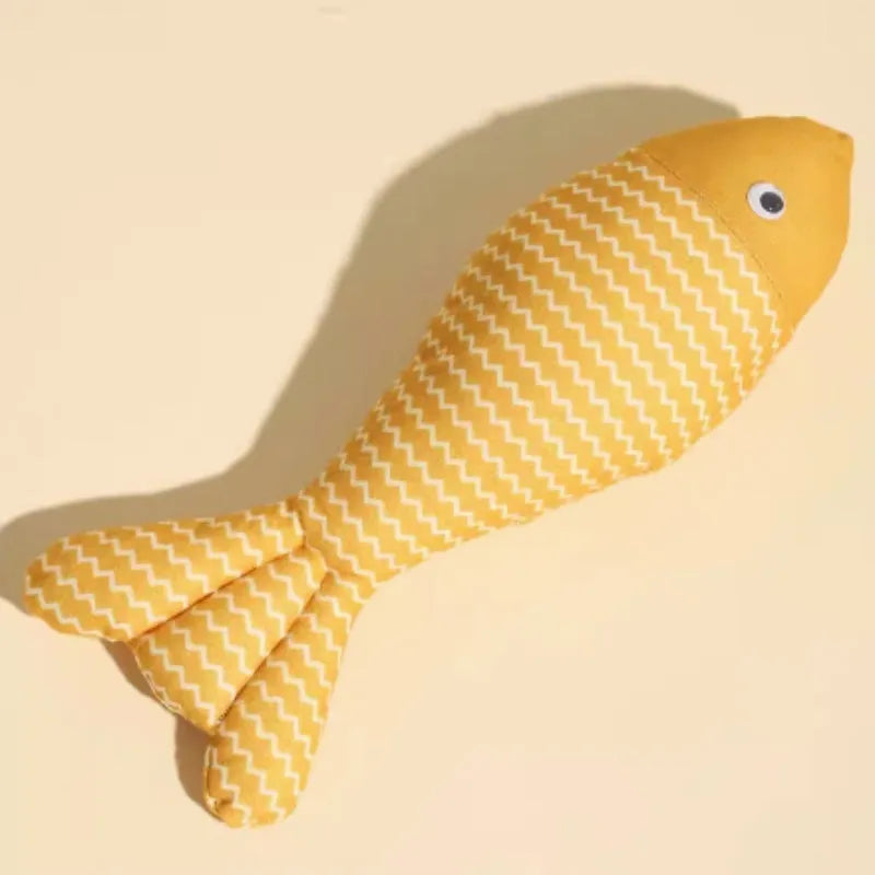 Yellow soft fabric cat toy shaped like a fish, a catnip-filled toy for feline play.