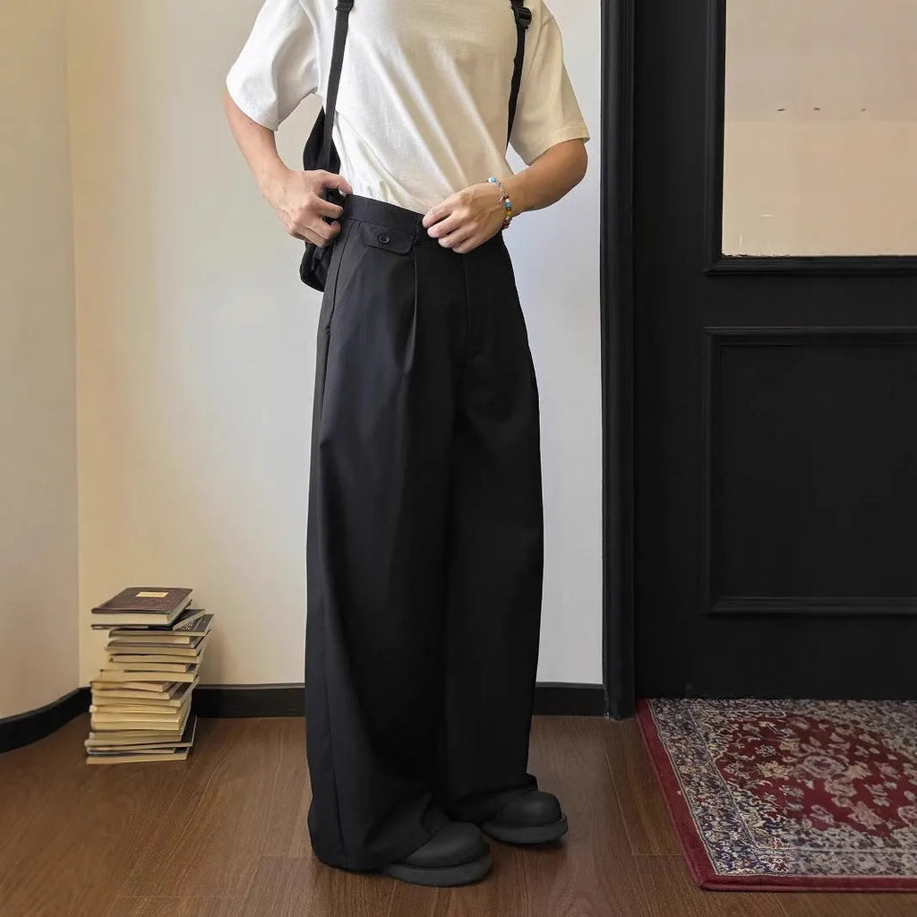 Men's brown straight-leg wide-leg casual trousers showing drape and fit