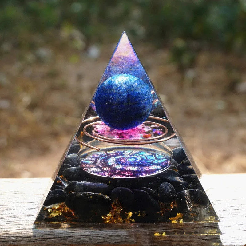 Small 6cm clear epoxy resin pyramid ornament with embedded pieces of natural coloured crystal gravel.