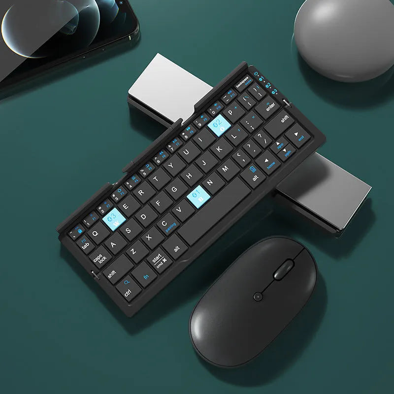Silver white folding Bluetooth keyboard with integrated phone stand, shown open for typing and folded for storage