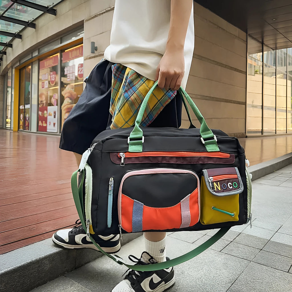 Large black oxford cloth sports messenger shoulder bag showing its spacious main compartment.
